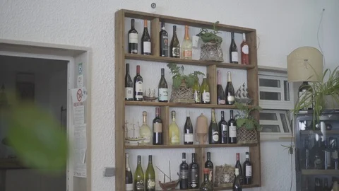 Wine bottles on a shelf Stock Footage 86075733