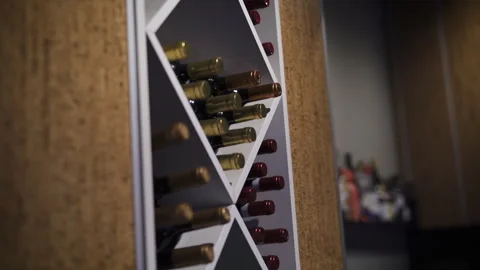 Wine Bottles on Shelf Stock Footage 243128477