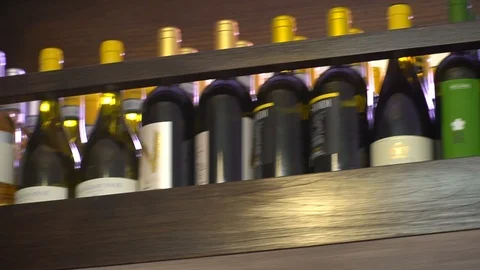Wine bottles show case Stock Footage 89783109