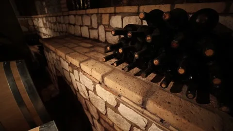Wine bottles stored in a wine cellar of a winery Stock Footage 221547124