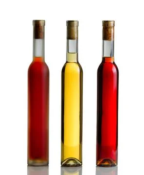 Wine bottles on white with reflection Stock Photos