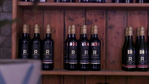 Wine Bottles On Wooden Shelf Inside Cozy Pub Stock Footage 340594850