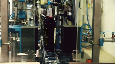 Wine bottling production line. Liquors bottling in Tuscany Stock Footage 59644042