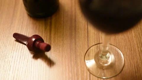 Wine cap rocking next to wine Stock Footage 141730608
