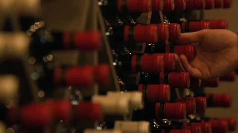 Wine Cellar Bottle Hand Grabbing Pulling Red Winery Sommelier Vídeo Stock 128758841