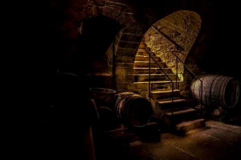 Wine cellar in low light Stock Photos