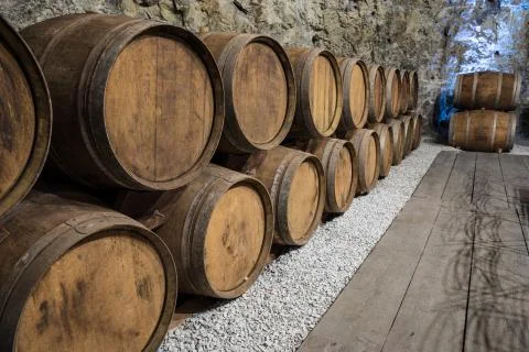 Wine Cellar with oak barrels Stock Photos