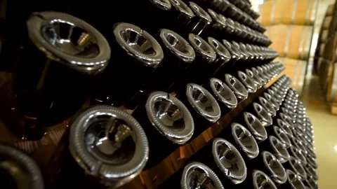 A Wine Cellar. Storage Room for Wine in Bottles and Barrels. Old wine in a dark  Stock Footage 227952732