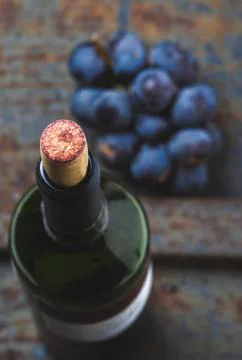Wine concept - wine, grape on rustik dark background. Top wiew Stock Photos