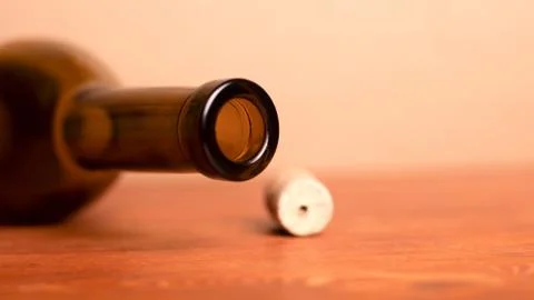 Wine cork and lying empty  bottle  on the table... Wine cork and lying empty  Stock Photos