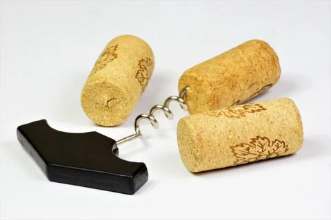 Wine corks and a corkscrew for uncorking. Stock Photos