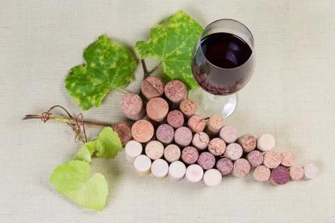 Wine corks lying in form of grape cluster, red wine Stock Photos