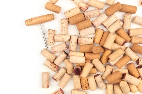 Wine corks on a white background, with a corkscrew and copy space Photos