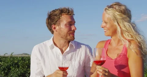 Wine drinking couple at vineyard laughing toasting Video stock 86340546