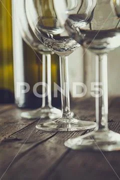 Wine. Empty wine glass. in wine cellar. Old white wine on wood.Arranged wine Stock-Fotos
