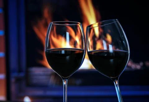 Wine by the fireplace Stock Photos