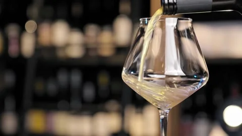 Wine forms beautiful wave. Wine pouring in wine glass Stock Footage 170232972