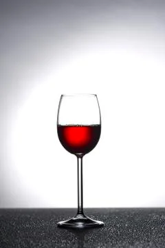 Wine glass in backlight Stock Photos