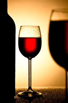 Wine glass in backlight Stock Photos
