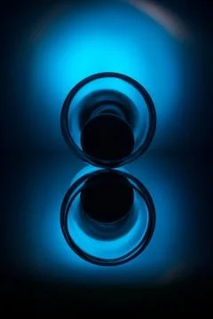 Wine glass with egg lying on table Stock Photos