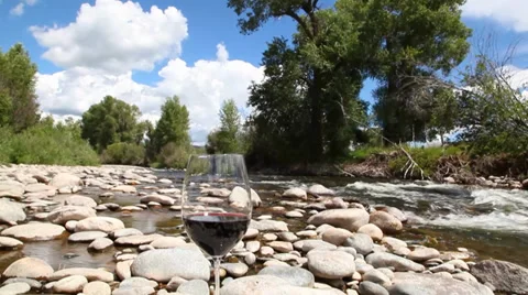 Wine glass by river Vídeos de archivo 35761490