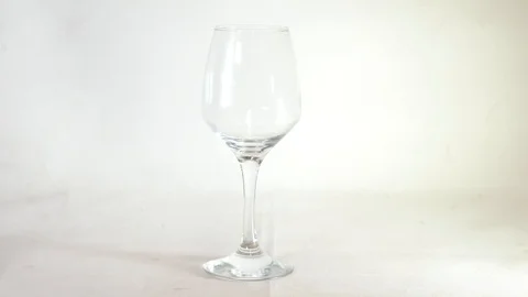 The wine in the glass on white background Stock Footage 101663262