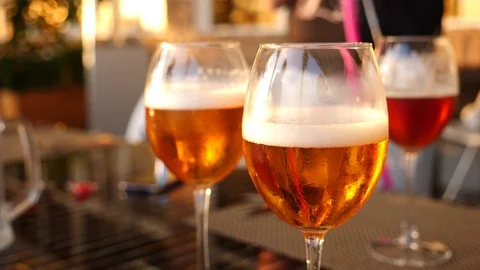 Wine glasses with alcohol close-up. Slow motion. Beer tasting Stock Footage