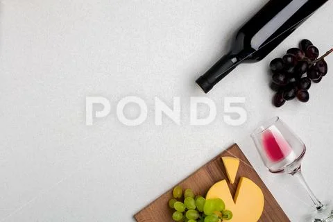 Wine, glasses and corkscrew over white background. Top view Stock Photos