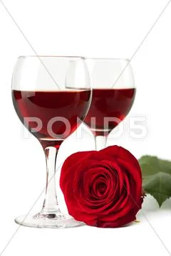 Wine glasses and red rose isolated Stock Photos