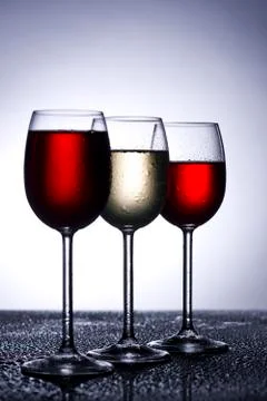 Wine glasses in backlight Stock Photos