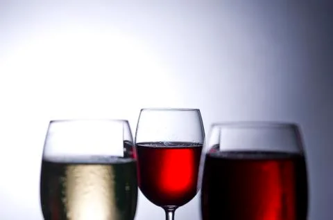 Wine glasses in backlight Stock Photos