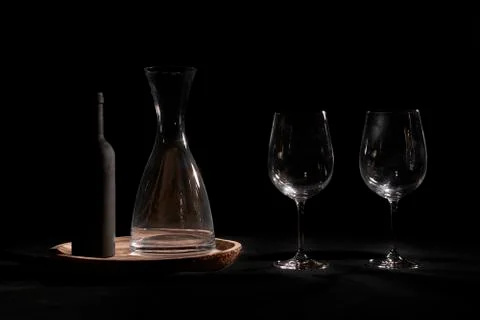 Wine glasses with bottle and pourer. Stock Photos