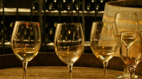 Wine glasses on cask in wine cellars Stock Footage