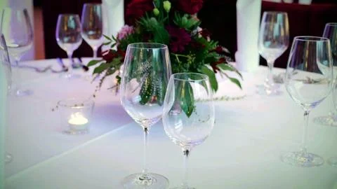 Wine glasses on a decorated table. Stock Photos
