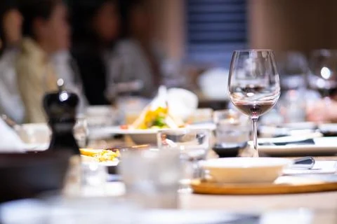 Wine glasses on the dinner table in a fine restaurant Stock Photos