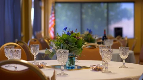 Wine glasses dinner table with flowers at wedding reception party Stock Footage 93261747