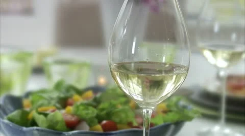 Wine glasses at a dinner table Stock Footage 11288906