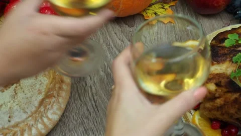 Wine glasses in front of chicken dinner, pour wine Thanksgiving  Christmas Stock Footage 257600493