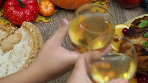 Wine glasses in front of chicken dinner, pour wine Thanksgiving  Christmas Stock Footage 257600637