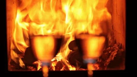 Wine glasses in front of fireplace Video stock 69990691