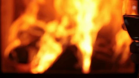 Wine glasses in front of fireplace 스톡 동영상 72716229