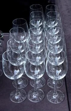 Wine glasses on grey surface Stock Photos