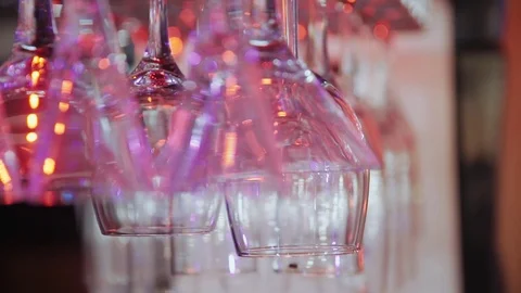 Wine glasses hanging from a rack. Stock Footage 71287937