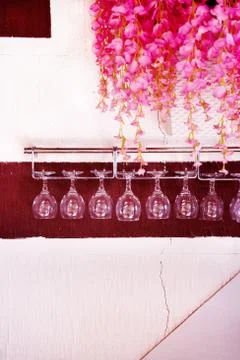 Wine glasses hanging up side down. Stock Photos