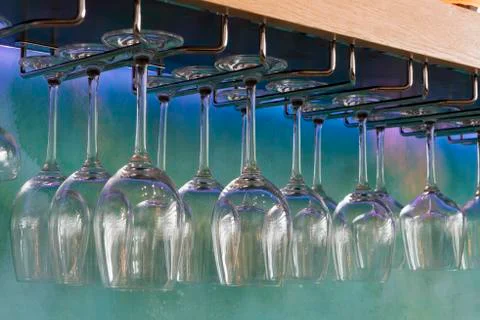 Wine Glasses Hanging on a Stemware Rack Stock Photos