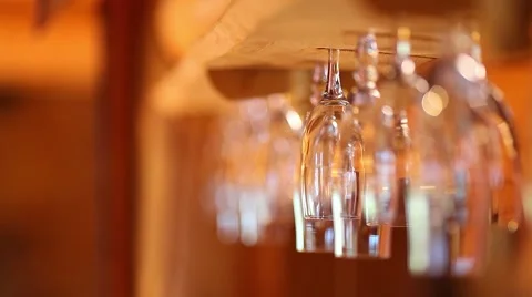 Wine glasses hanging upside down in the bar Video stock 46015314
