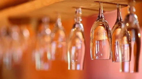 Wine glasses hanging upside down in the bar Video stock 46015315