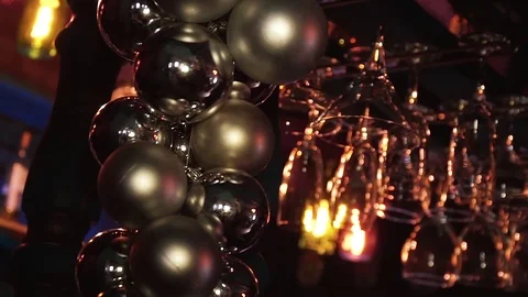 Wine glasses upside down hanging in a bar Video stock 107120019