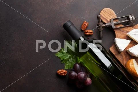 Wine, grape and cheese Stock Photos