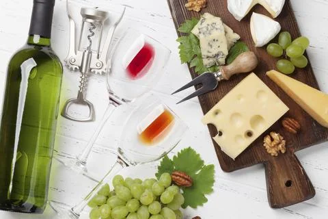 Wine, grape, nuts and cheese. Top view Stock Photos